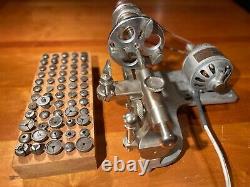 Watchmakers lathe with three jaw faceplate chuck and 60 collets
